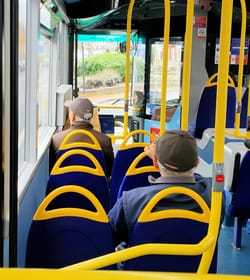 Older folks are rocking baseball caps over flat caps