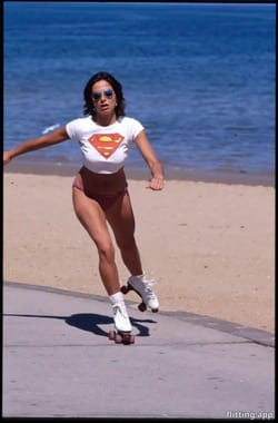Roller skating woman at St Kilda Beach in 80s Melbourne