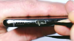 Clean your phone's charging port before it gets stuck